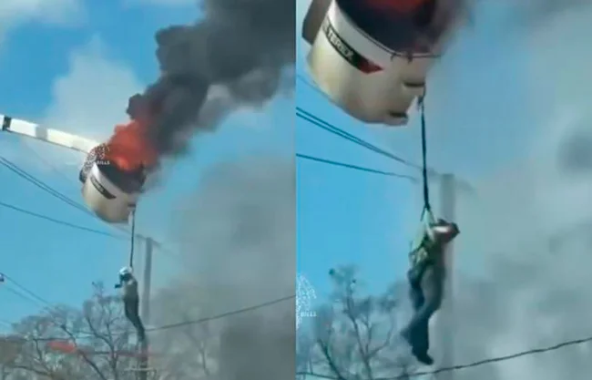 Queda trabajador colgando de camión en llamas mientras lucha por su vida