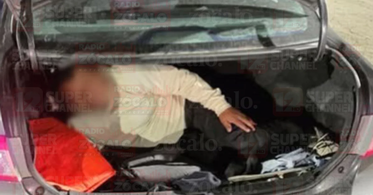 Hallan migrante oculto en cajuela